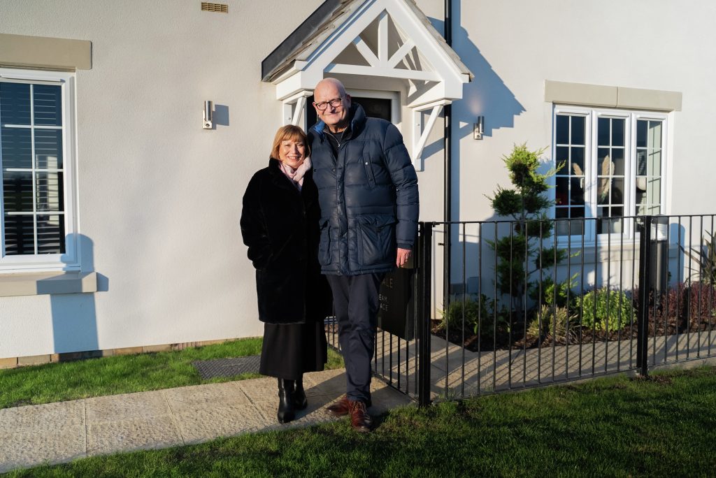 Couple outside home