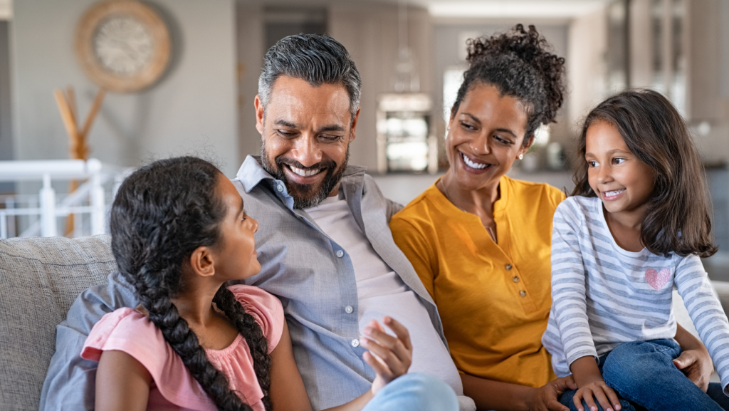 Family of 4 relaxing at home